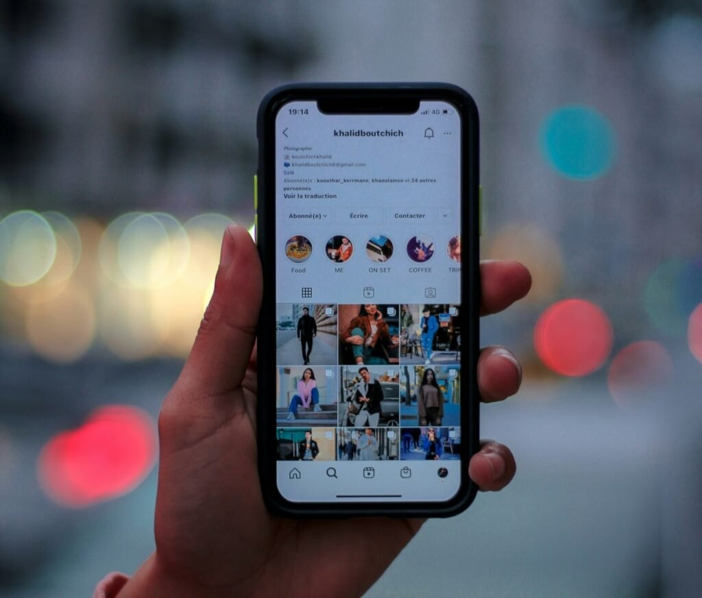 Instagram analytics dashboard showing story reach, impressions, and viewer metrics on a laptop screen
