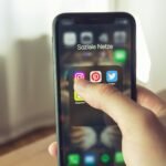 Download arrow icon above smartphone displaying Instagram stories ready to save